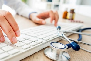 female-doctor-typing-on-computer-picture-id1018676898