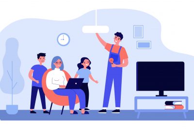 Technical worker changing lightbulb in chandelier