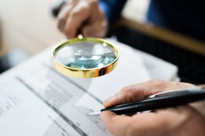 Fraud Detective Using Magnifying Glass