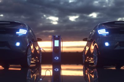 Electric cars charging at a charging station. 3d rendering