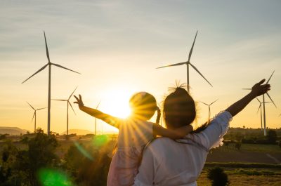 Wind turbines are alternative electricity sources, the concept of sustainable resources, People in the community with wind generators turbines, Renewable energy