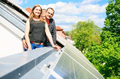 home owners are happy with solar panels on his roof