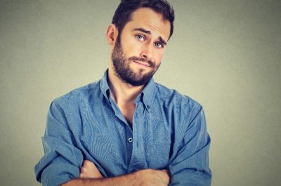 skeptical-man-looking-suspicious-disgust-on-his-face-picture-id492225300